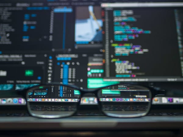 Code on screen representing software component analysis